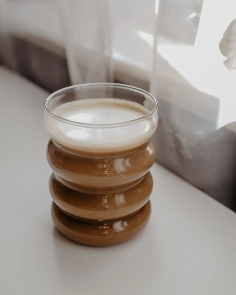 Aesthetic coffee in a clear textured cup.